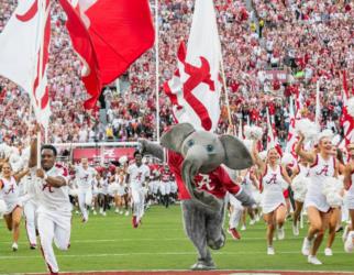 University of Alabama football game with students and mascot