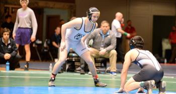 wrestlers facing off on the mat