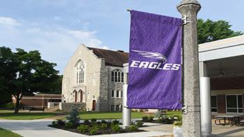 campus building with 'eagles' banner
