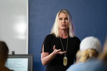 a lecturer speaking to an audience
