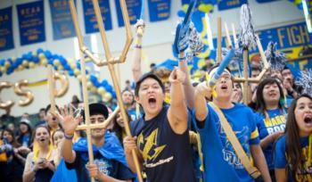 students cheering at a sports event