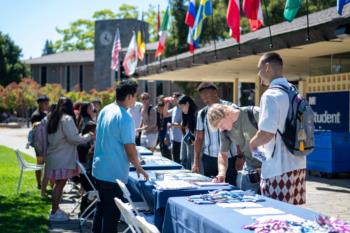 Menlo College students at a campus club and activities fair. 