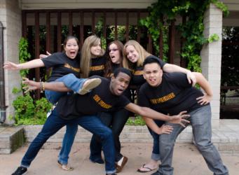 students posing playfully outdoors