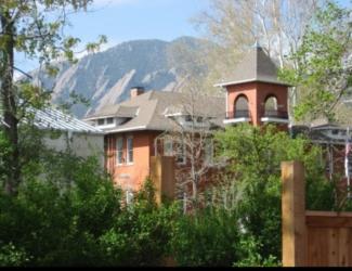 campus building with mountain backdrop