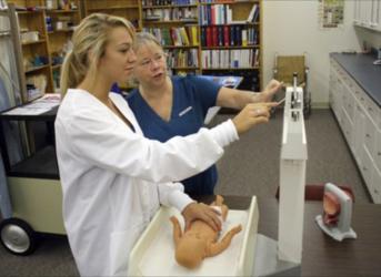 nursing student practicing with instructor