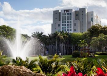 'fiu' building with a water fountain and palm trees