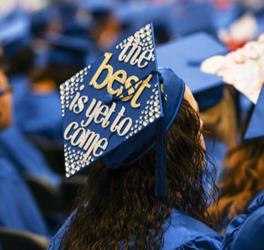 graduation cap with 'the best is yet to come' design in blue and white