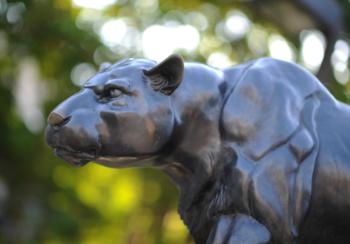 statue of a panther with a blurred background