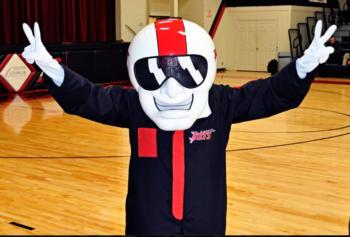 mascot in costume making peace signs in gym