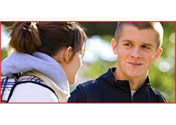 two students smiling outdoors