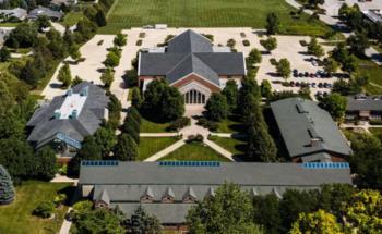 aerial view of college campus with several buildings and green spaces