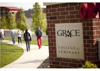 grace college and seminary sign with people