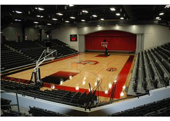 empty basketball court with stadium seating