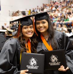 Cowley College graduates with diplomas