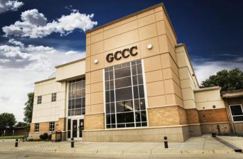 building with gccc letters and large glass windows