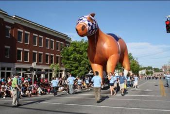 giant balloon of a horse in a parade