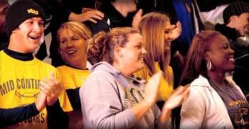 crowd of people cheering at an event
