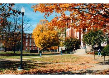 autumnal scene with campus building and colorful trees