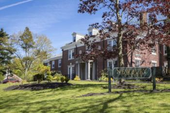 brick building with 'newbury college' sign in front