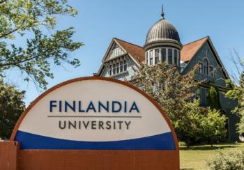 campus building behind 'finlandia university' sign