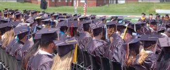 graduation event with students in caps and gowns