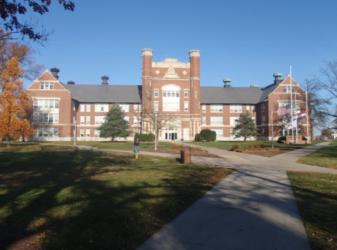 historic brick building with clear blue sky