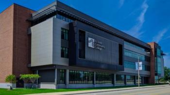 modern building with saint louis community college logo and flag