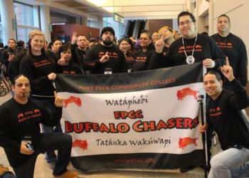 group of students holding a banner with 'fpcc buffalo chasers' and logo