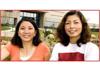 two women smiling outdoors