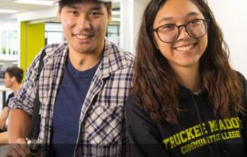 two smiling students inside truckee meadows community college building