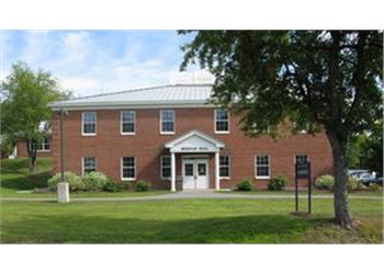 brick building with 'greene hall' sign