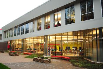 modern building with glass facade and illuminated interior