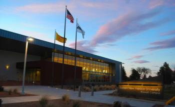 eastern new mexico university roswell campus entrance with flags at sunset