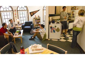 students socializing in a dormitory common room
