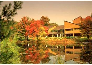 autumnal scene by a pond at pace university