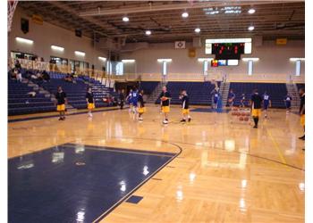 indoor basketball court with players training