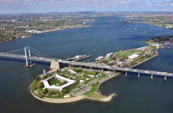 aerial view of campus with bridge and water