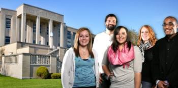 group of students in front of an academic building