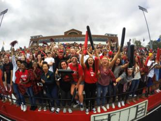 crowd of students cheering at homecoming