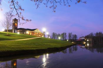 sunrise scene over campus buildings and lake