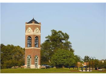 campus clock tower against blue sky