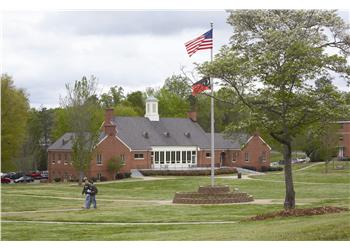 brick academic building with american flag