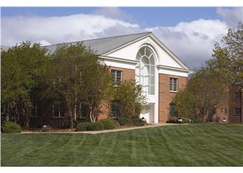 traditional campus building and lawn