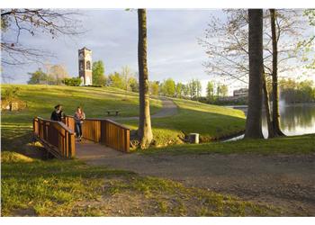 campus walkway with students enjoying sunset