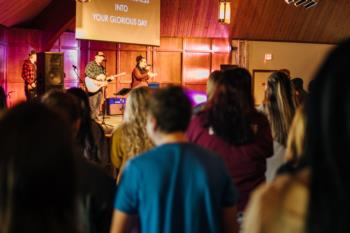 students at a chapel service with live music