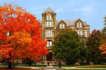 historic campus building with vibrant fall foliage