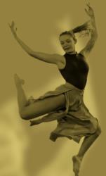 dancer in motion with a flowing skirt in a sepia tone