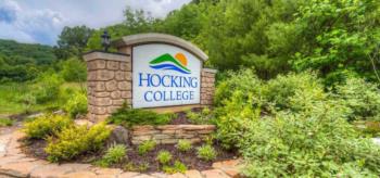 stone sign reads 'hocking college' with green and blue logo
