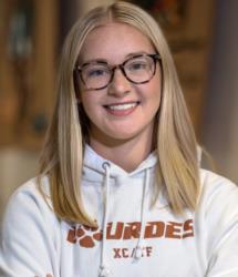 student with lourdes university hoodie