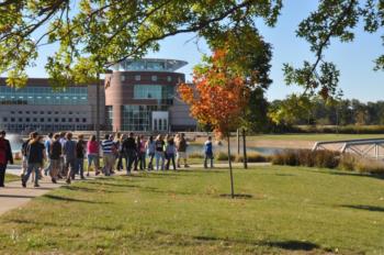 students walking on a path near a large brick building at marion technical college